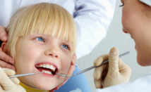 child receiving dental exam